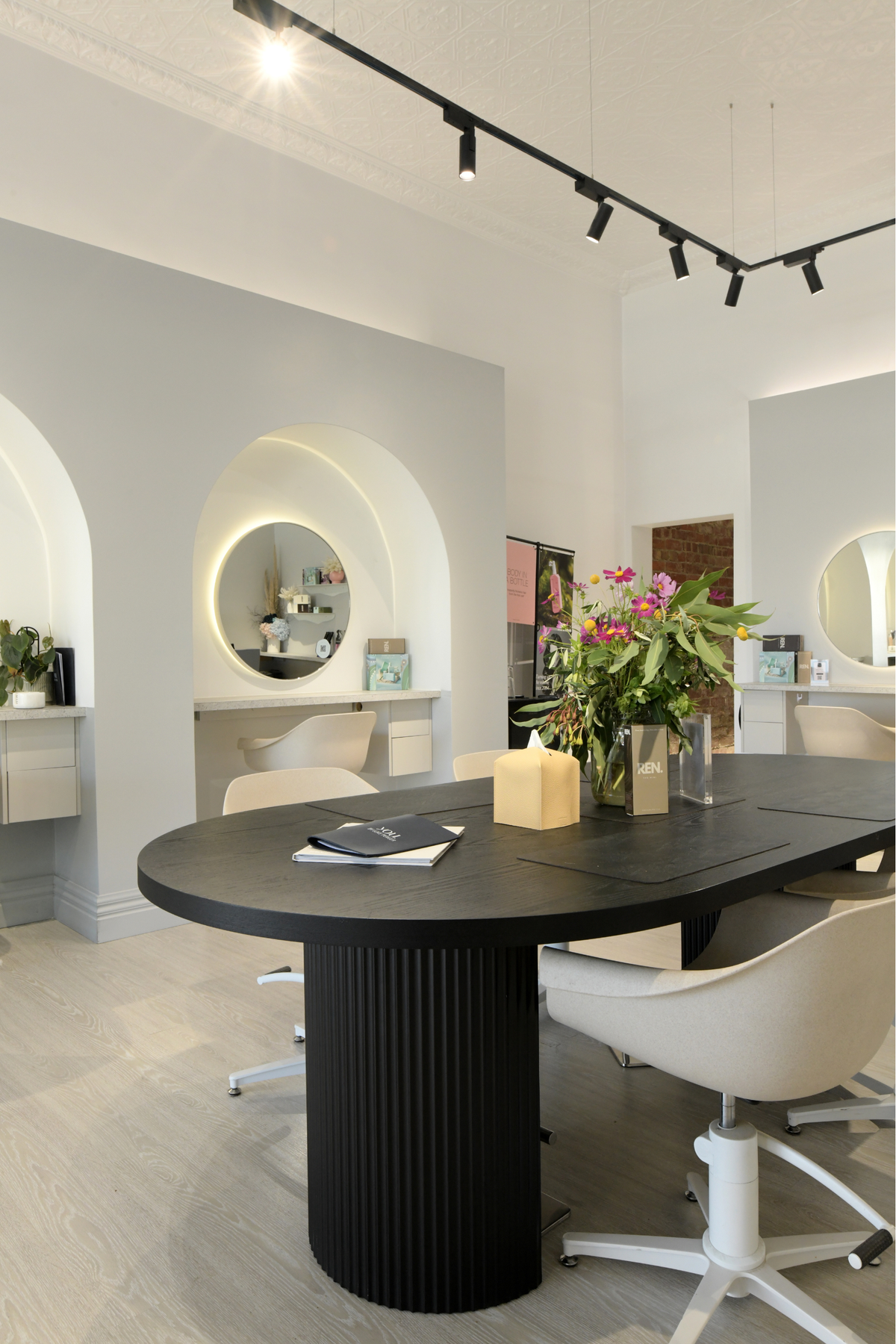 Light-filled colour salon with arched mirrors on Queens Parade, Fitzroy North